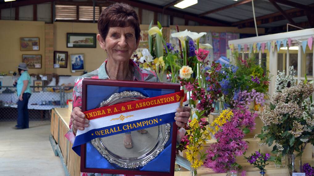 Jean Goodacre displays her champion ribbon and trophy from the 2015 Canowindra Show. Mrs Goodacre is a big supporter of the pavilion sections.