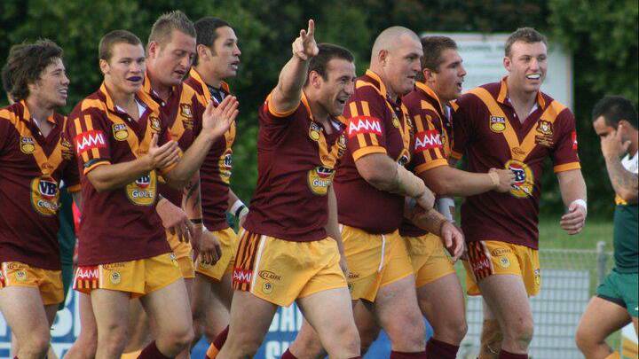 COUNTRY BOY: Chris Bamford (third from left) celebrates a try with his Country teammates against the Cook Islands, in 2011. He's excited to be playing representative footy for his adopted region on Saturday. 