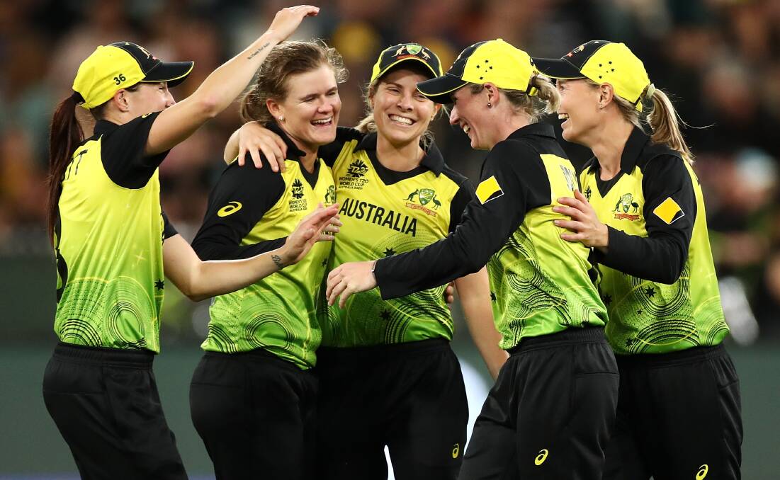 Jess Jonassen is mobbed after taking a wicket against India in the final. Picture: Getty Images