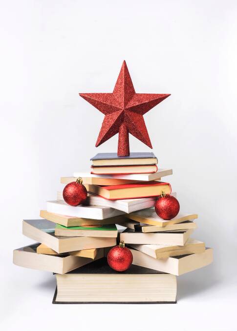 A few decorations added to a triangular stack of books can work wonders. 