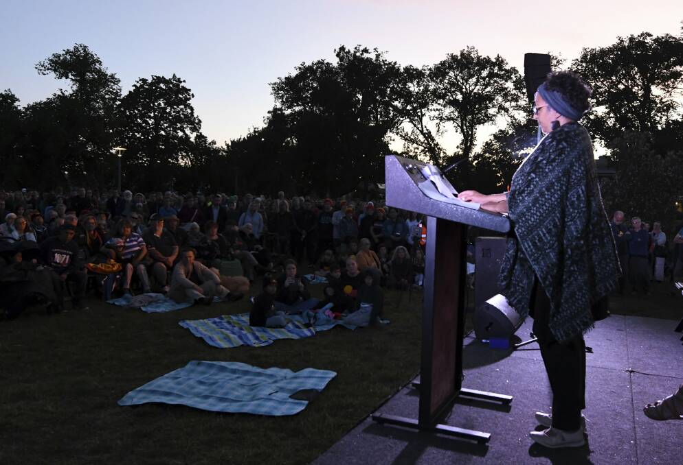 Maryanne Sam reads a list of Indigenous massacres at the Survival Day dawn ceremony. Picture: Lachlan Bence