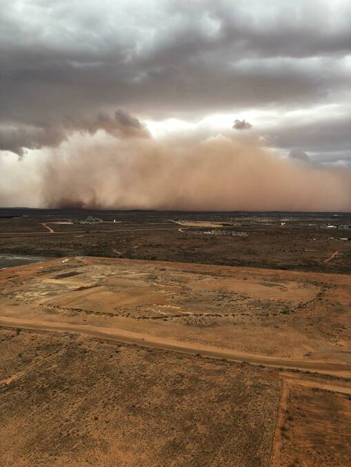 The dust storm is about to envelop Broken Hill. Picture by Jamie Henderson of Stock  and Station Aviation.