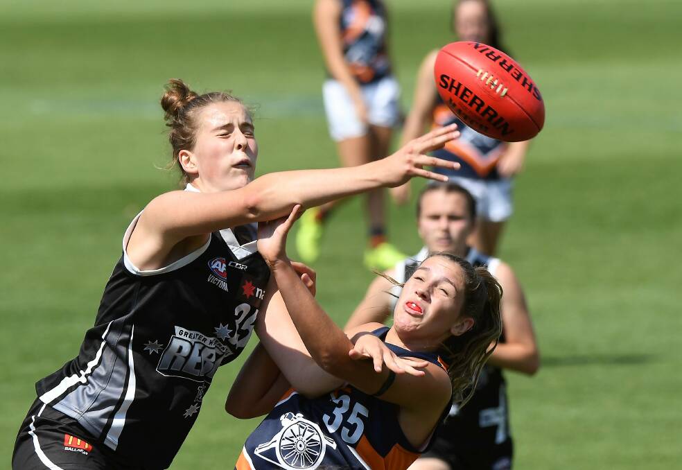 CODE SWITCH: Maggie Caris, left, played a large role for the Rebels in 2019 after coming to the program from elite netball. Picture: Adam Trafford.