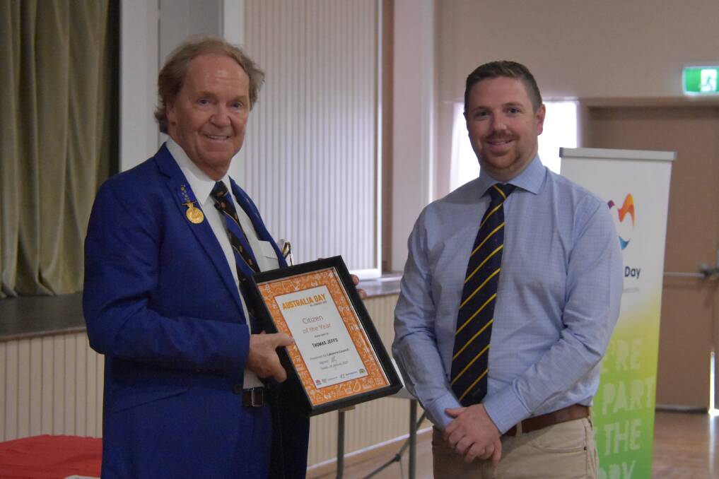 Tommy Jeffs receives his certificate for Canowindra Citizen of the Year from Councillor Jamie Jones. 