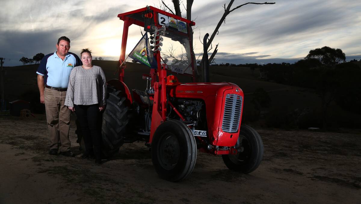 Nick and Amy Clancey, pictured in 2018, with their 1962 Massey Ferguson tractor that lead the inaugural charity 24 Hour Tractorthon. Photo: PHIL BLATCH 
