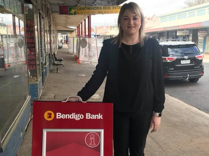 Customer service representative Kaila Millar outside the Bendigo Bank agency on Gaskill Street, Canowindra. The official opening is on Friday.