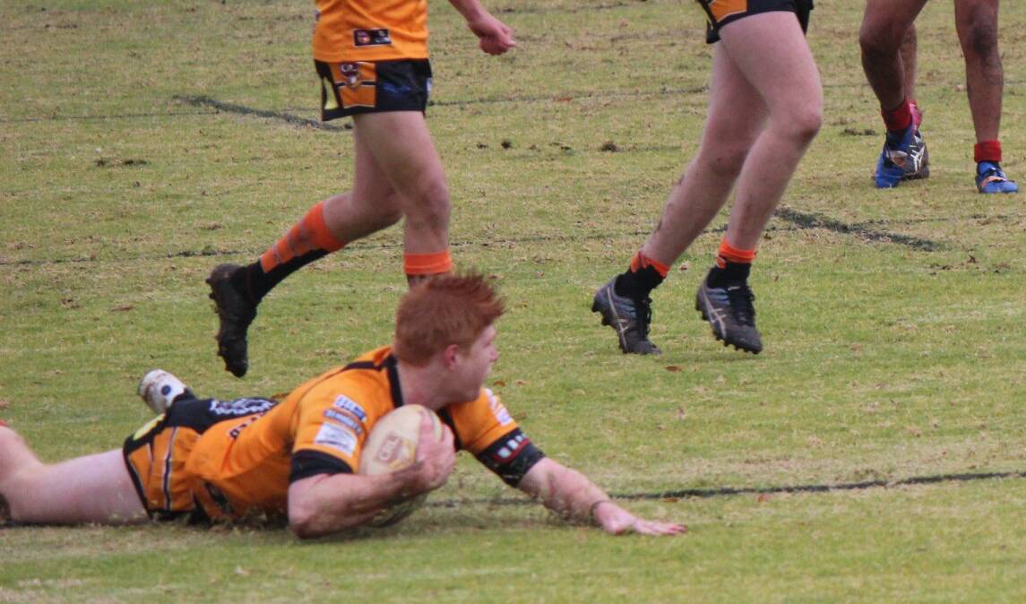 Regan Hughes scores a try for the Tigers in Sunday's clash at Tom Clyburn Oval.