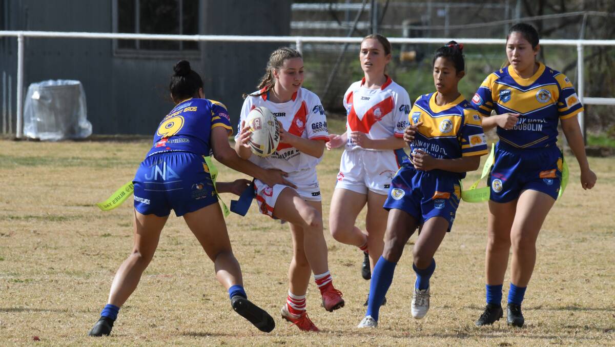 CLOSE: Manildra Rhinos and Condobolin Ramettes fought out a tie on Sunday. Photo: CARLA FREEDMAN