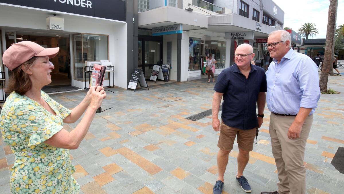 Scott Morrison with well-wishers in Cronulla mall after his retirement announcement. Picture by Chris Lane