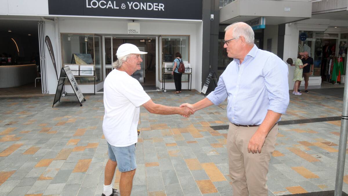 Scott Morrison is thanked by a well-wisher in Cronulla mall. Picture by Chris Lane