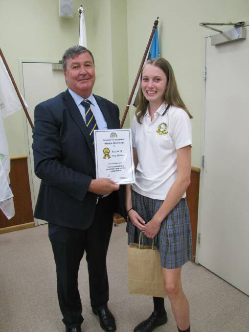  Maisie Harrison receiving her award from Cabonne mayor Kevin Beatty.