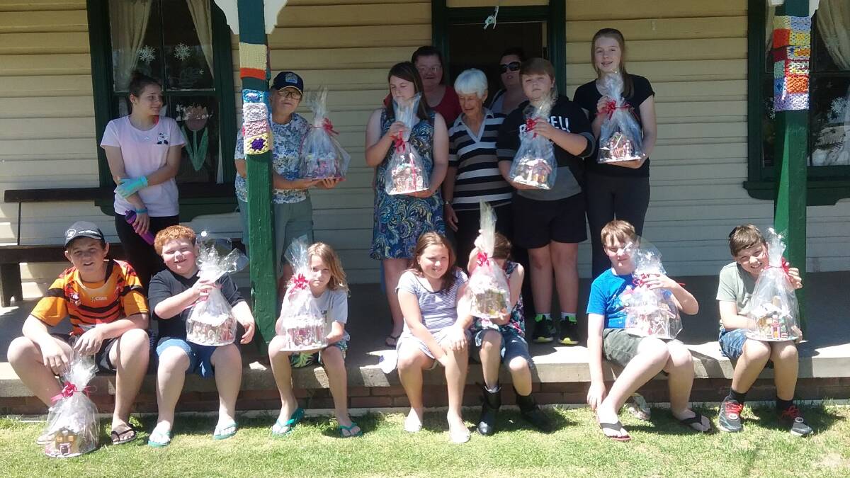 Canowindra Creative Centre attendees show off the gingerbread houses they made. The Canowindra Creative Centre is looking forward to running the day again next year.