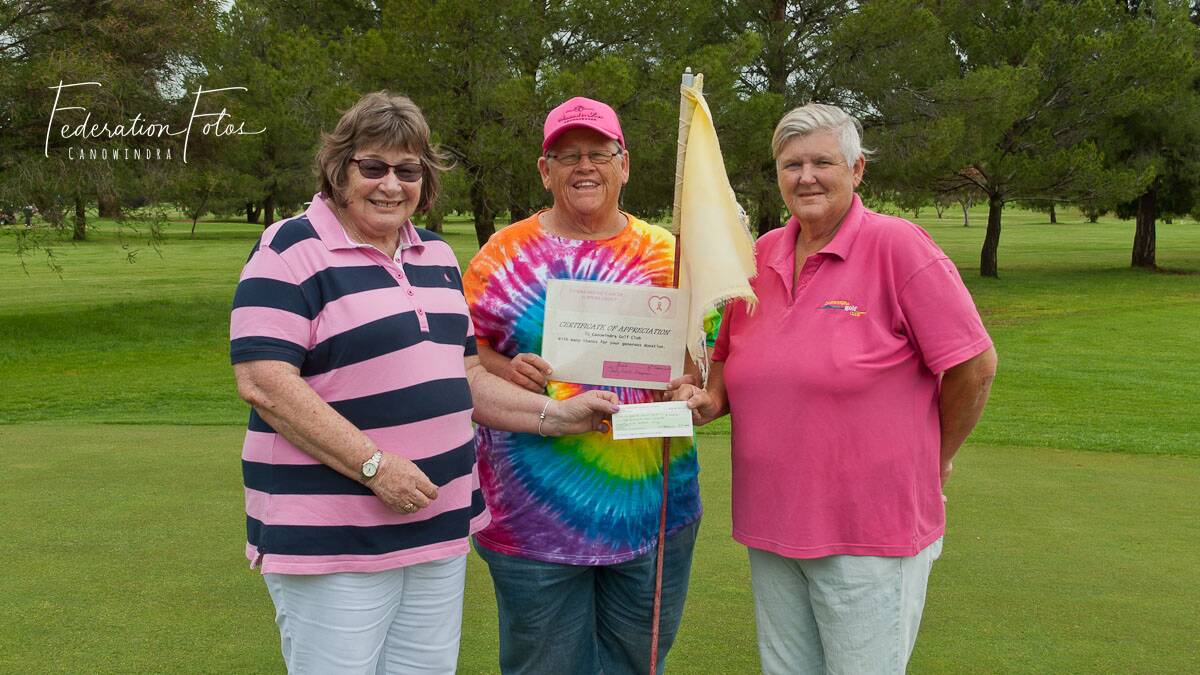 Jenny Friend is presented with the Golf Club's cheque by Helen Moriarty and Annette Thomas. Photo: Federation Fotos