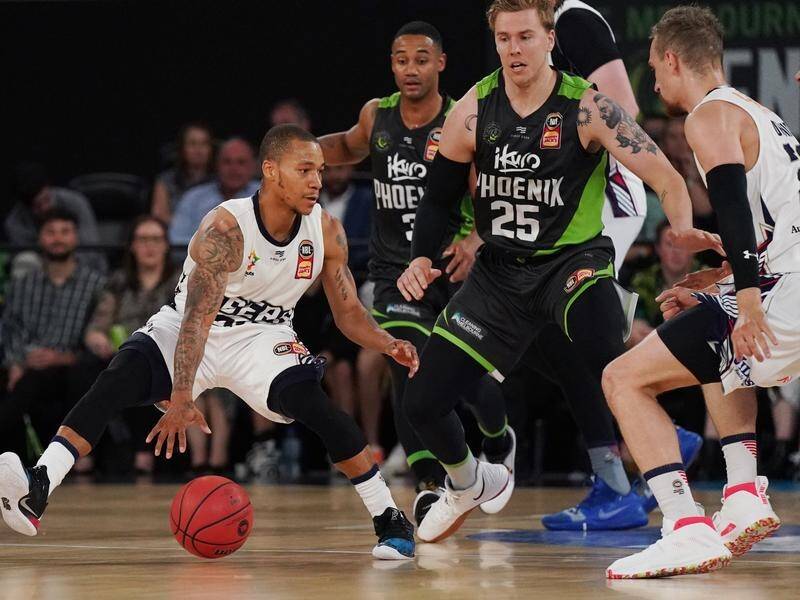 Jerome Randall (L) has bagged 27 points in Adelaide's 103-91 NBL defeat of South East Melbourne.