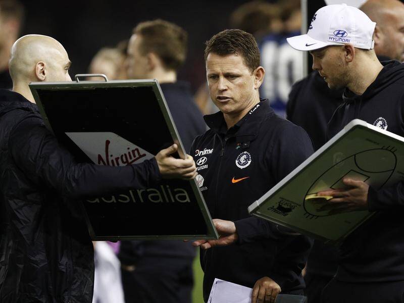 Scrutiny of Carlton AFL coach Brendon Bolton (C) has intensified after another loss for the Blues.