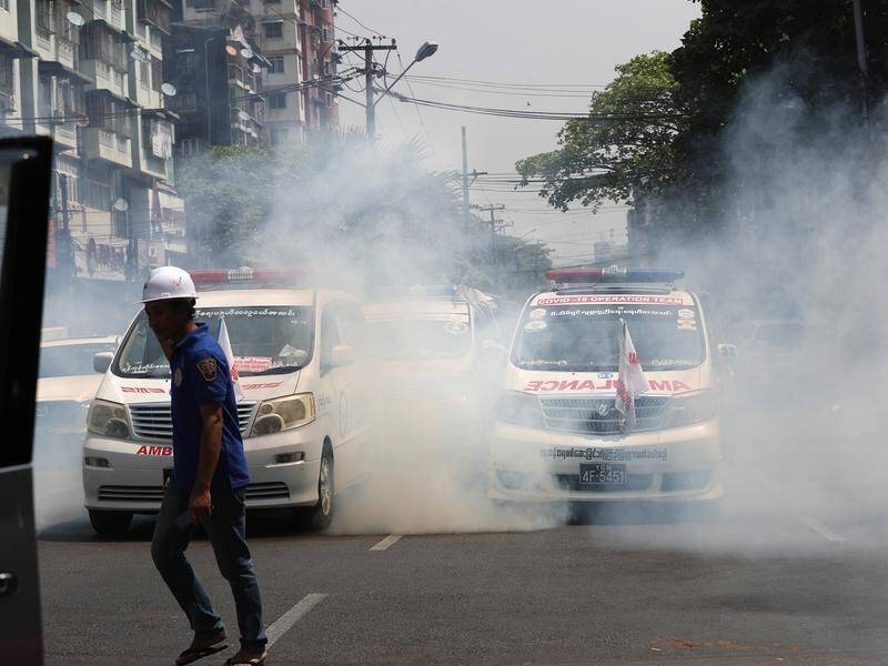 Riot police have fired tear gas at protesters in Yangon as Myanmar's pro-democracy rallies continue.