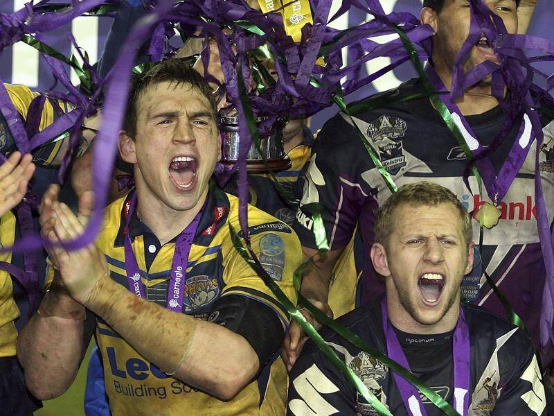 Kevin Sinfield (L) is raising funds to help MND sufferers like former teammate Rob Burrows (R). (AP PHOTO)
