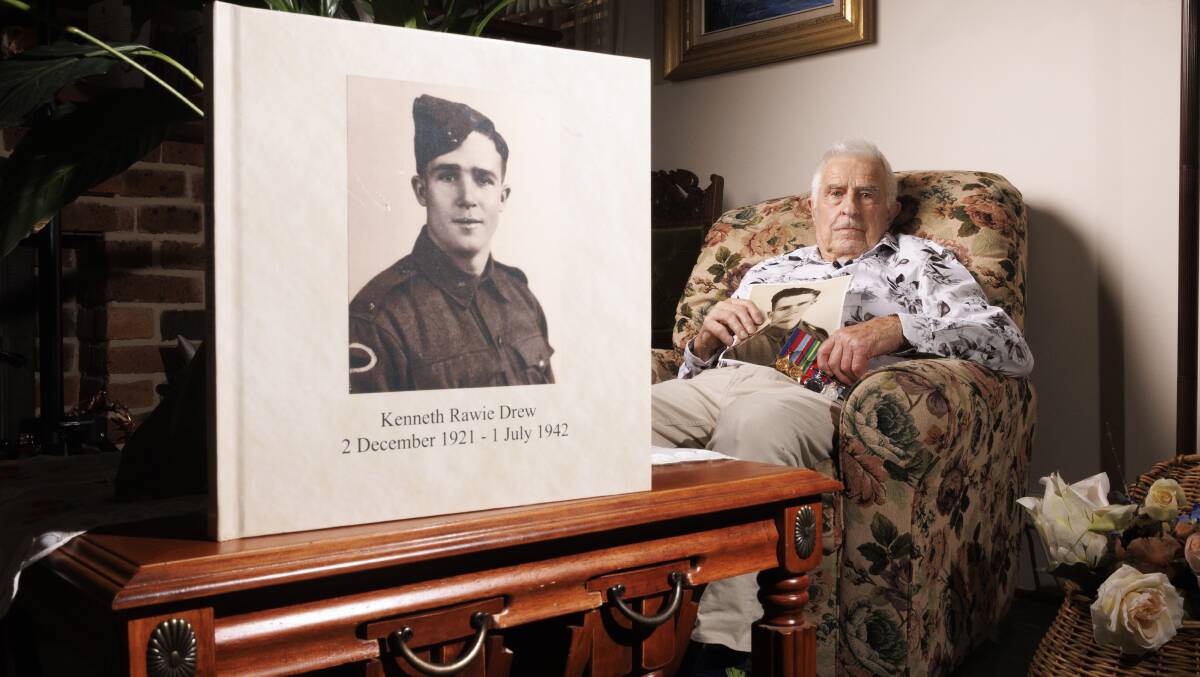 Les Drew, 90, and the picture of his brother Ken who died on the Montevideo Maru. Picture by Keegan Carroll