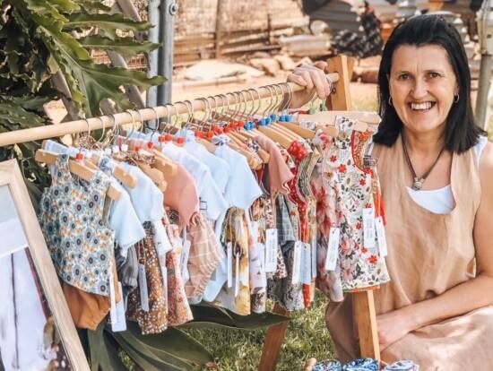 HELPING HAND: Parkes woman Cath King, who co-owns children's clothing and gift store Mama Bear, says the Buy from the Bush campaign is a fantastic initiative to help country retailers. Photo: SUPPLIED