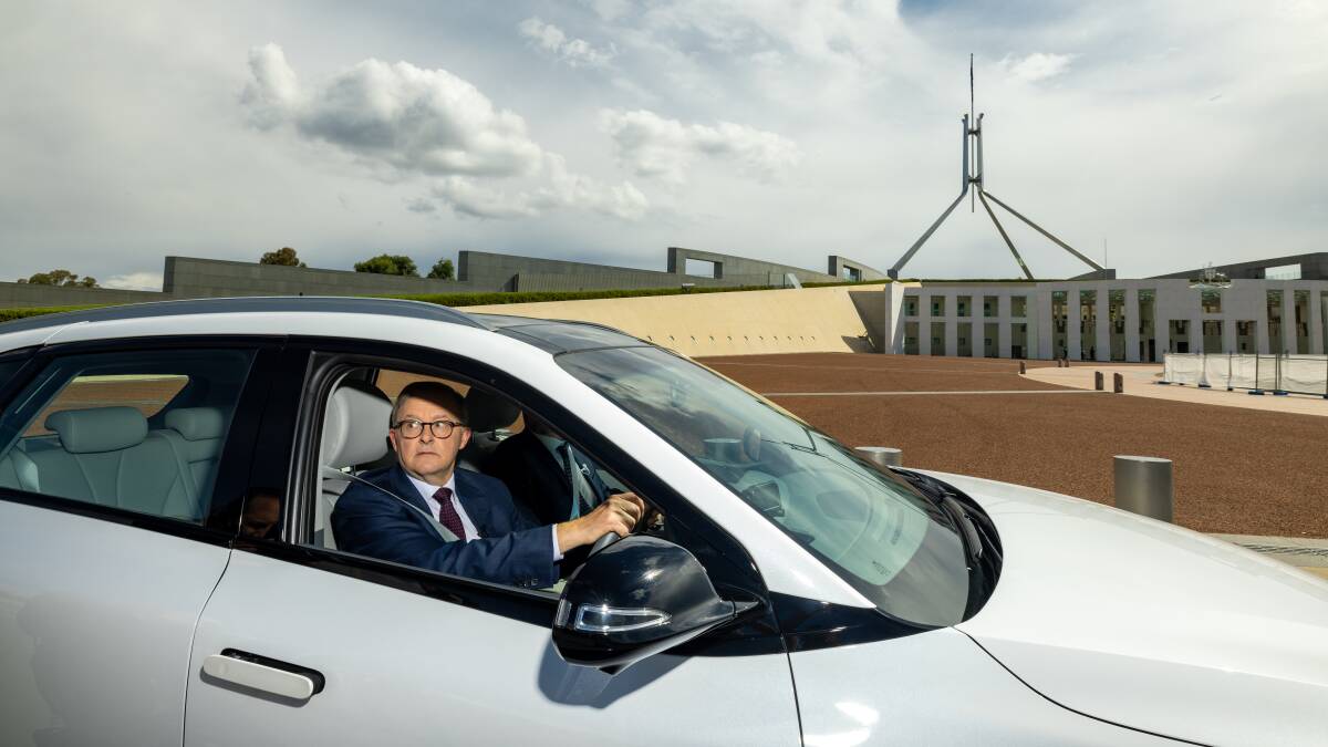 Labor leader Anthony Albanese, picture driving an electric car outside Parliament House, is poised to announce Labor's new climate target on Friday. Picture: Sitthixay Ditthavong
